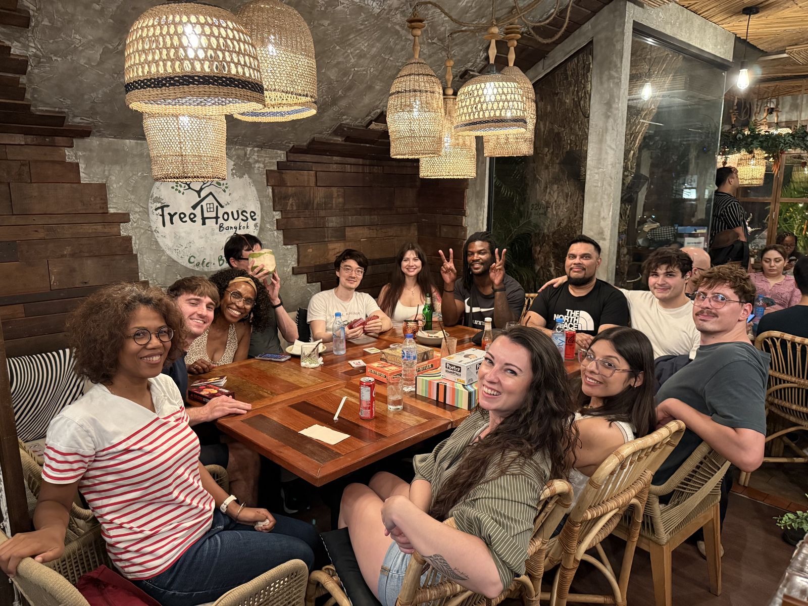 Guests smiling around the tables at Game Night, Treehouse Cafe & Bar