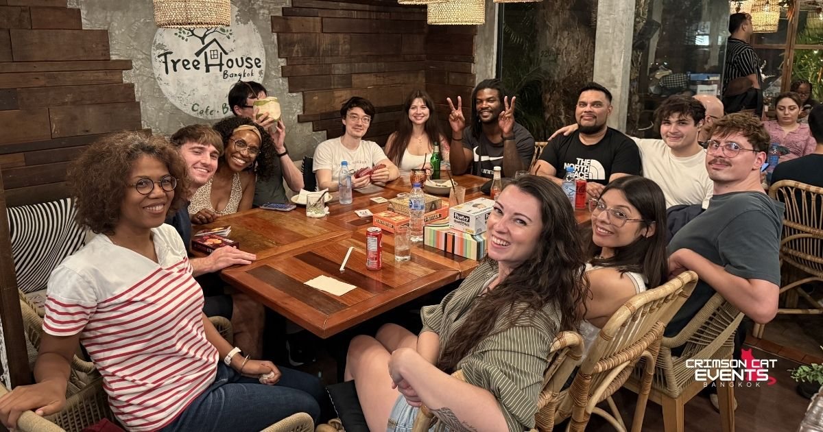 A full, smiling table at Game Night, Treehouse Cafe & Bar